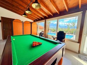 a billiard room with a pool table in a house at The Horse Farm Hotel in Kyrenia
