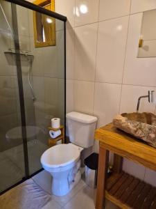 a bathroom with a toilet and a shower and a sink at Cabana refúgio do tico tico 07 in Cunha +80 photos
