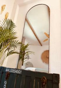 a mirror sitting on top of a wooden chest at Finca W - Coín - Málaga - Andalucía in Coín +47 photos