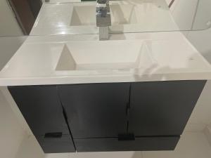 a white sink in a white counter in a bathroom at Casa do Val in Fernando de Noronha +14 photos