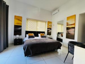 a bedroom with a bed with two pillows on it at 8villa in St. Julianʼs +31 photos