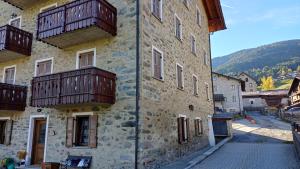 a building with balconies on the side of it at Sambor apartment in Oga