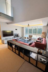 a living room with a couch and a table at Villa Dream in Kuşadası