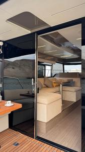 a view of the inside of a boat with a table at MYTH bay in Bandar Jişşah