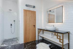 a bathroom with a sink and a mirror at Villa Maris in Povlja +27 photos