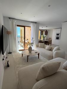 a living room with a couch and a table at ALTEA LUXURY - Blue Pearl in Altea la Vieja