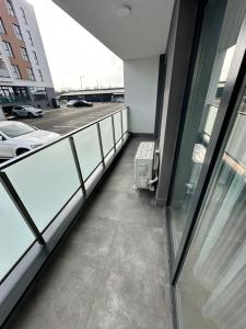 a balcony of a building with a view of a parking lot at Sara Home in Baia Mare