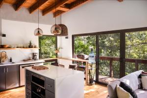 an open kitchen with a view of a living room at Villa Sea Breeze in West End