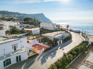 an aerial view of a city with a road at La Perla Sul Mare in Forio d'Ischia