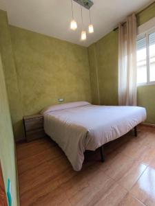 a bedroom with a bed in a room at El Rincón de Playasol in Puerto de Mazarrón