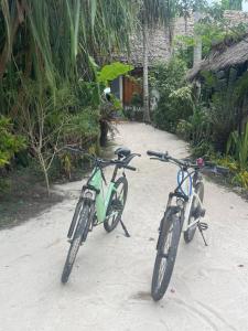 two bikes are parked on the beach at VeriDiana Hotel Zanzibar in Dimbani