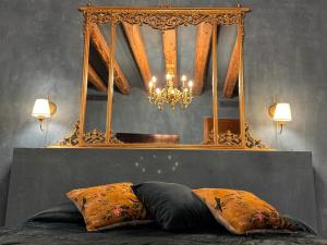 a bedroom with a mirror and a bed with two pillows at NEW OPENING San Marco Secret 4343 in Venice