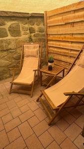 two chairs and a table on a patio at Rose Boardinghouse 24h-7d Self Check-In Automat in Großbottwar
