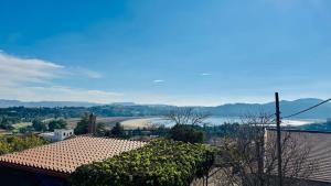 a view of a town with a river and mountains at Casa tua a Pergusa in Pergusa