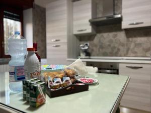 a table with a tray of food and a bottle of water at Casa Mami' in Marigliano