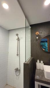 a bathroom with a shower and a sink at abot langit calatagan in Calatagan +18 photos