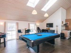 a living room with a pool table in it at 14 person holiday home in Blåvand in Blåvand