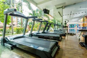 a row of treadmills lined up in a gym at Nova Platinum Hotel in Pattaya South
