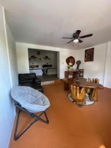 a living room with a table and a couch at Casa Paraiso Hotel Boutique in Puerto Escondido