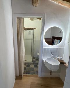 a bathroom with a sink and a mirror at La casina del borgo - Monolocale Nettuno in Perugia