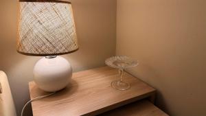 a lamp sitting on a table next to a fan at Apart 9 de julio in Salta