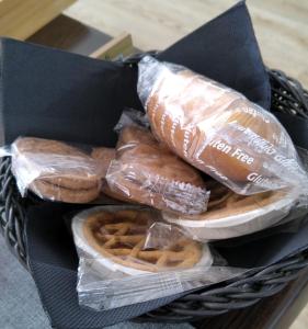 a basket of donuts and pretzels in plastic wrap at Beb lungo tiflis matrimoniale, quadrupla in Bitonto