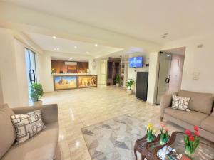 a living room with a couch and a table at Glory Pyramids Inn in Cairo