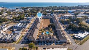 an aerial view of a town with a large balloon at SEA-Bound STR in Pensacola
