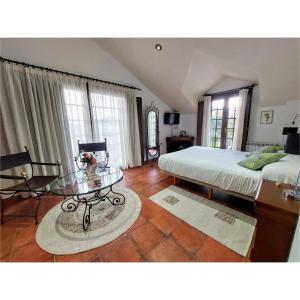 a bedroom with a bed and a glass table at Hotel Apartamento Marouco in A Guarda +134 photos