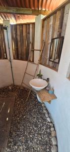 a bathroom with a sink in a room at Chacahua Cabañas LAUD in Guayabas