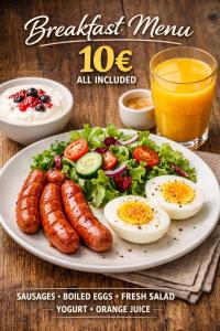 a plate of sausage eggs and salad with a glass of orange juice at Terminal 1 in Pʼarakʼar