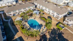 an aerial view of a resort with a swimming pool at SEA-Bound STR in Pensacola