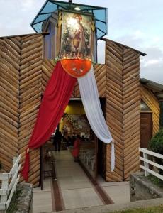 a building with a restaurant with a drink in it at Hotel CasaBlanca"Tablon de miraflores" in Cuenca
