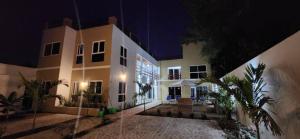 a night view of a building with a courtyard at Meztli Beach House in La Manzanilla +11 photos