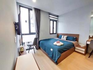 a bedroom with a bed with a bowl on it at Lunaria Maison - HCM Center Stay in Ho Chi Minh City