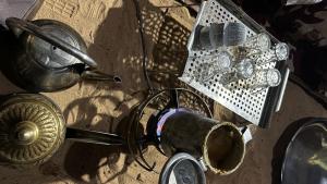 a bunch of items sitting on the ground at Red sand tent in Disah