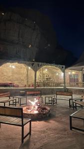 a group of benches in front of a fire pit at Star night in Disah