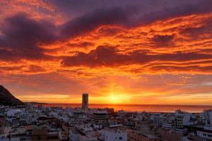 a view of a city at sunset at Romantic Sea View Studio with Jacuzzi in Alicante Center in Alicante
