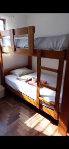 a couple of bunk beds in a room at Dodig in Chincha