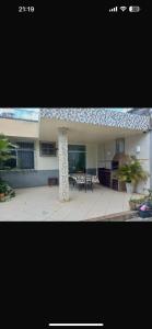 a picture of a house with a patio and a building at Villa sonhos in Belém