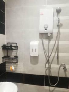 a bathroom with a blow dryer and a sink at Katika Home 2 in Ban Khlong Haeng +10 photos