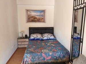 a bedroom with a bed and a dresser and a mirror at Lahnzauber Obernhof in Obernhof