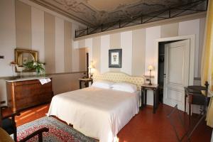 Postel nebo postele na pokoji v ubytování Hotel Villa Beccaris