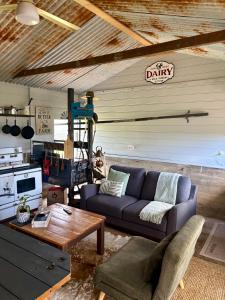 a living room with a couch and a table at Edington on Mary - The Dairy in Gympie +38 photos