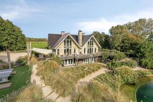 an aerial view of a large house with a garden at Duinvilla Noordwijk in Noordwijk