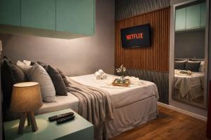 a hotel room with a bed and a sign on the wall at The Birthplace of Samba Carioca in Rio de Janeiro +16 photos