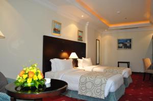 Posteľ alebo postele v izbe v ubytovaní Musherib Hotel