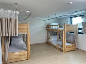a room with three bunk beds in a room at 여주여행자센터 호스텔 in Yeoju +54 photos