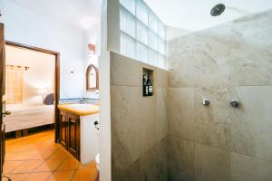 a bathroom with a shower and a sink at Amare Las Villas in Sayulita +36 photos
