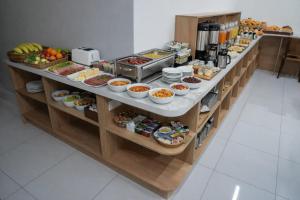 a buffet with many different types of food on display at NINETY boutique hotel in Yakkasaray